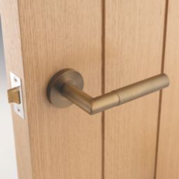 Eclipse Ultimate Revolve Fire Rated Lever On Rose Door Handle Pair Antique Brass 1 Pair