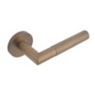 Eclipse Ultimate Revolve Fire Rated Lever On Rose Door Handle Pair Antique Brass 1 Pair