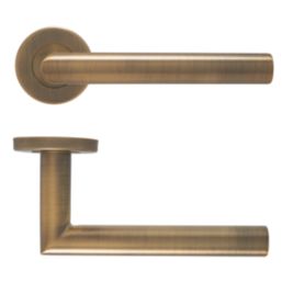 Eclipse Insignia Mitred Fire Rated Lever on Rose Door Handle Pair Antique Brass