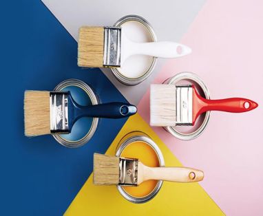 paint brushes on paint tin