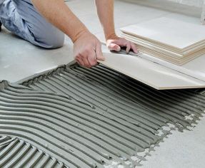 Image of floor tiles being laid